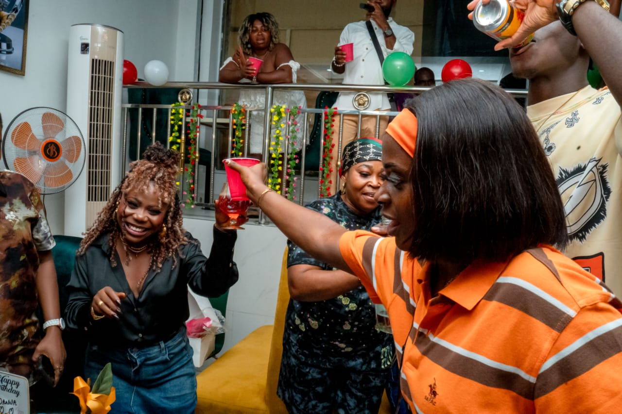 Guests enjoying a party at Jogik with drinks, balloons and laughter